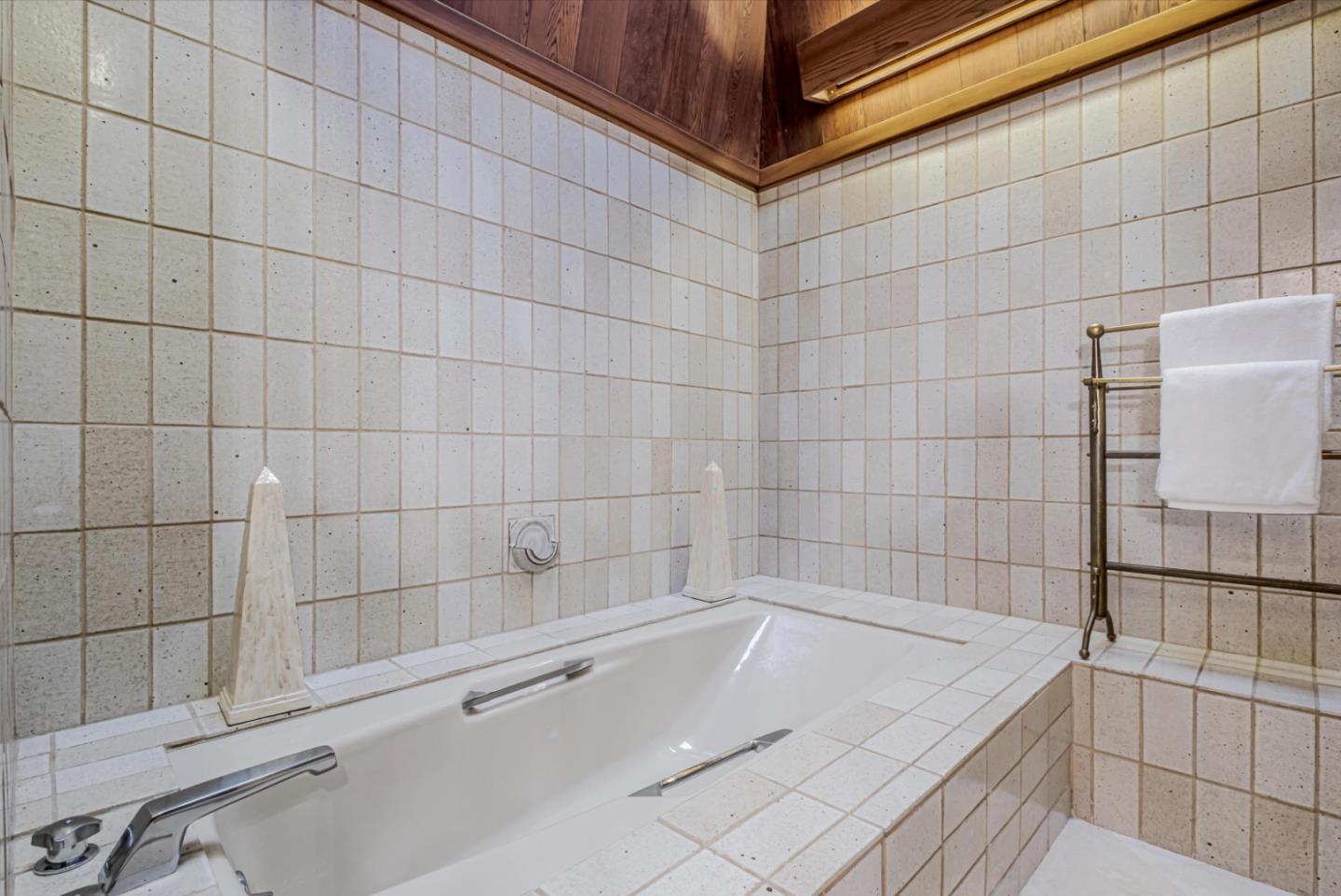 17070 Lon Road Los Gatos, CA 95033 - Photo 26 of 56 a bathroom with a bathtub and shower
