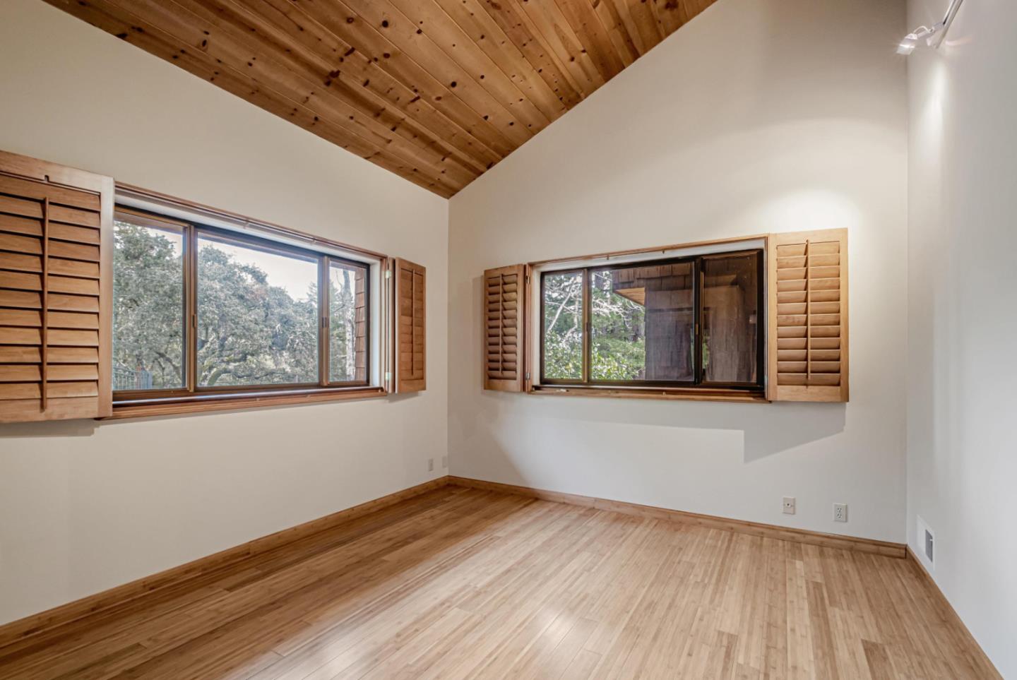 17070 Lon Road Los Gatos, CA 95033 - Photo 28 of 56 a view of an empty room with wooden floor and a window