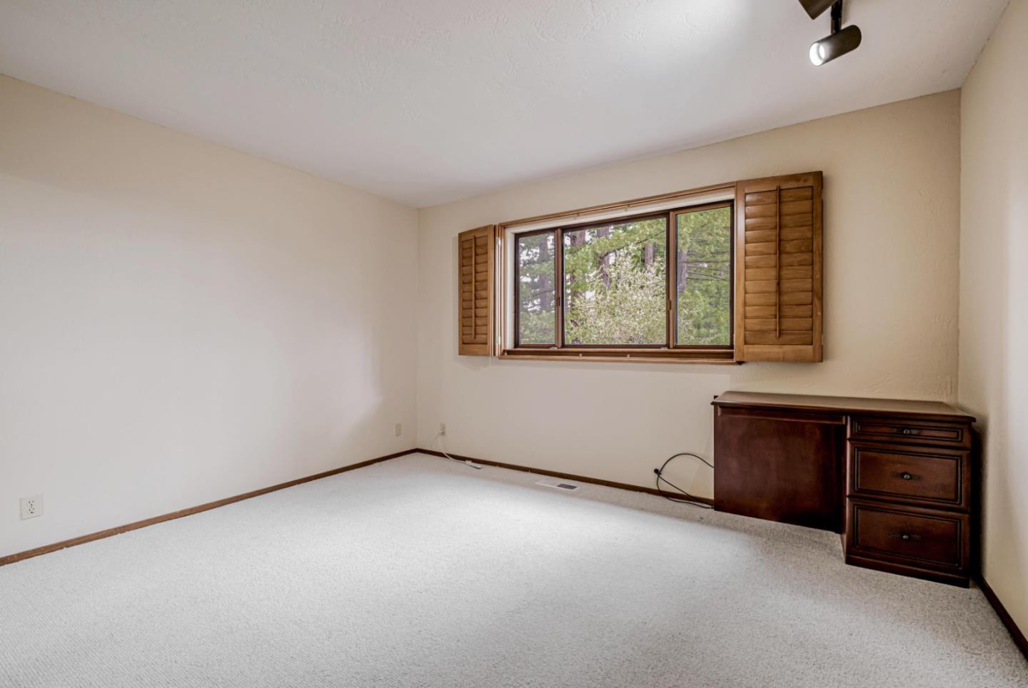 17070 Lon Road Los Gatos, CA 95033 - Photo 29 of 56 an empty room with furniture and window