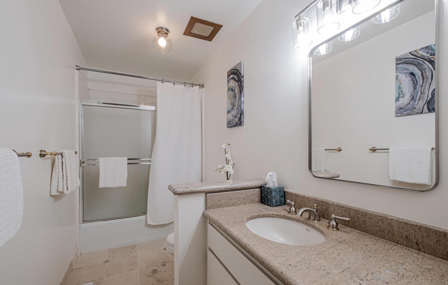 17070 Lon Road Los Gatos, CA 95033 - Photo 32 of 56 a bathroom with a granite countertop sink and a mirror