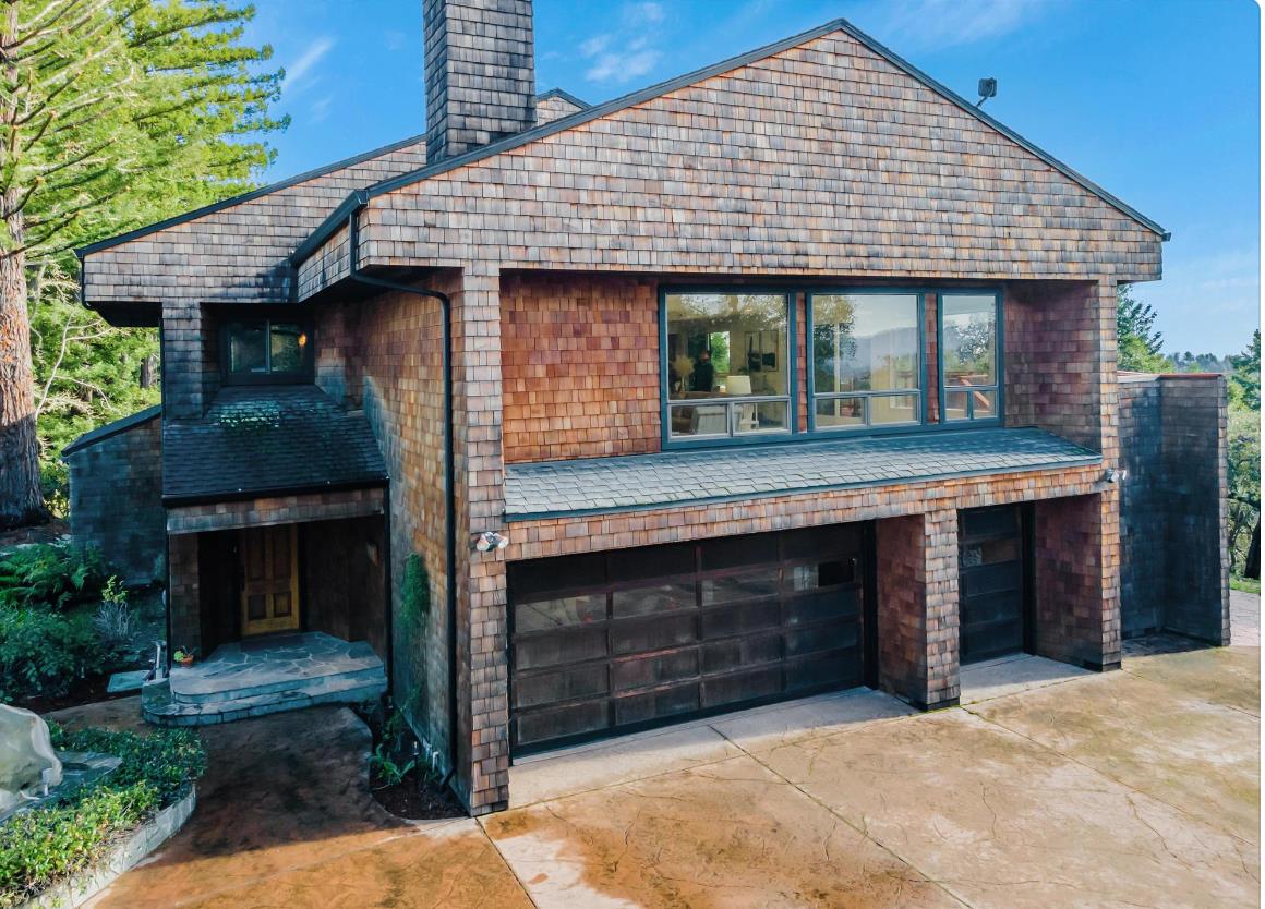 17070 Lon Road Los Gatos, CA 95033 - Photo 40 of 56 a front view of a house with a yard and garage