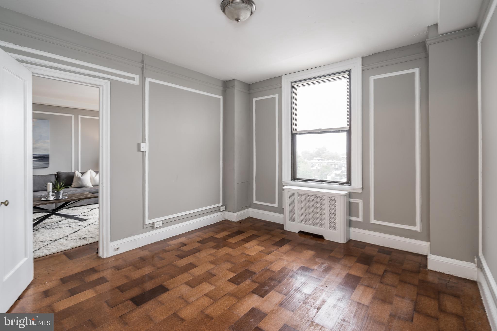 2031 Locust Street, Unit 602 Philadelphia, PA 19103 - Photo 11 of 24 a view of empty room with wooden floor and fan