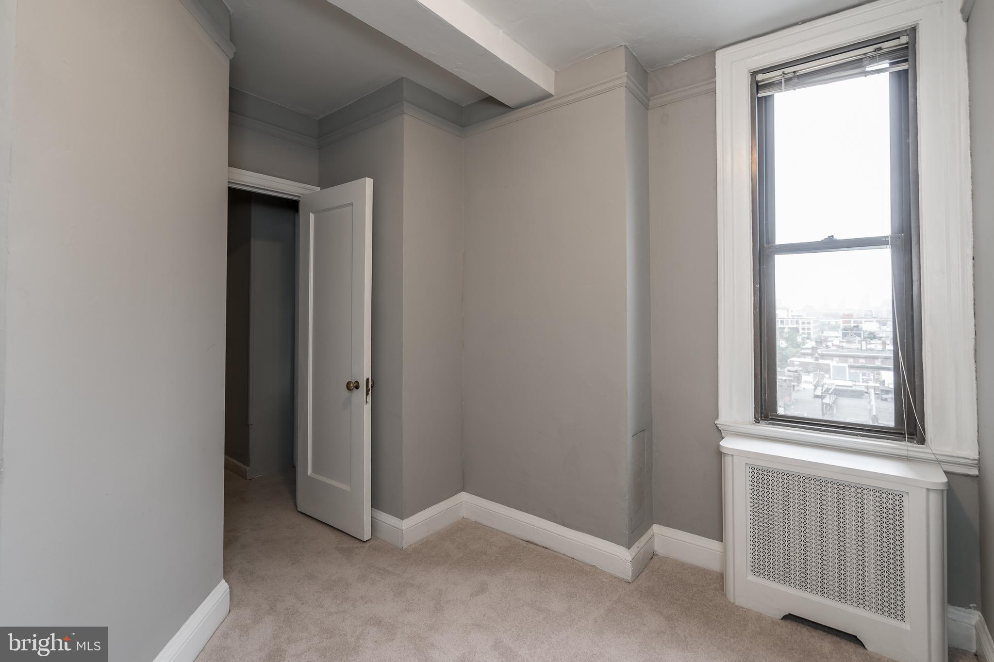 2031 Locust Street, Unit 602 Philadelphia, PA 19103 - Photo 14 of 24 an empty room with windows