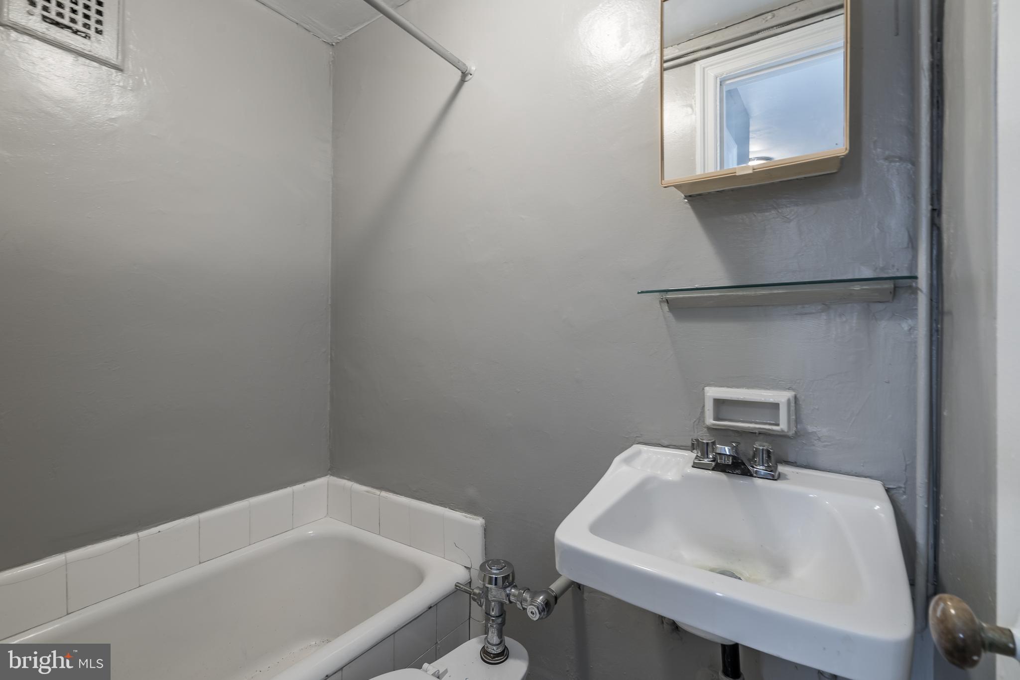 2031 Locust Street, Unit 602 Philadelphia, PA 19103 - Photo 16 of 24 a bathroom with a sink and a toilet