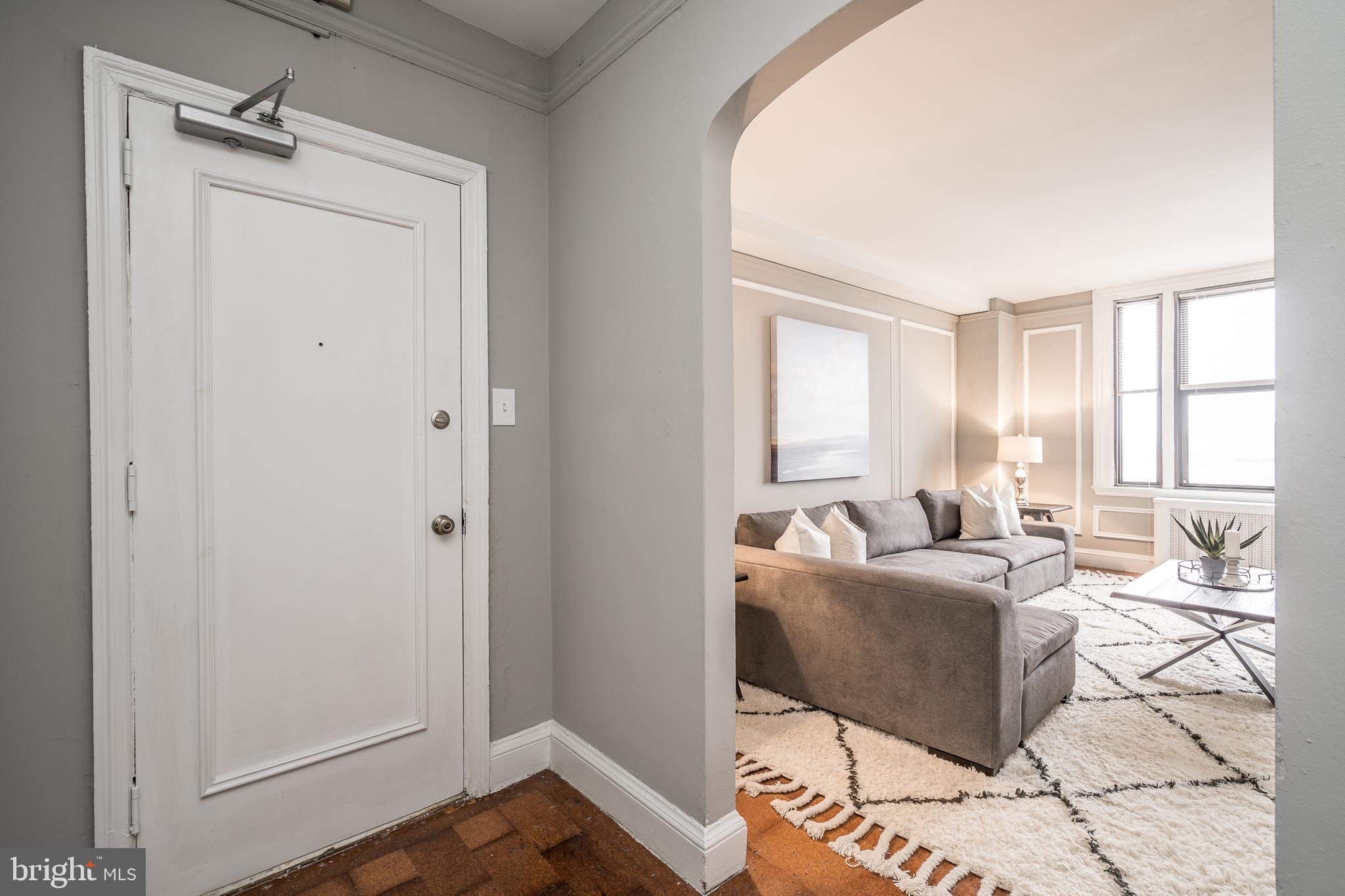 2031 Locust Street, Unit 602 Philadelphia, PA 19103 - Photo 17 of 24 a living room with furniture and a window