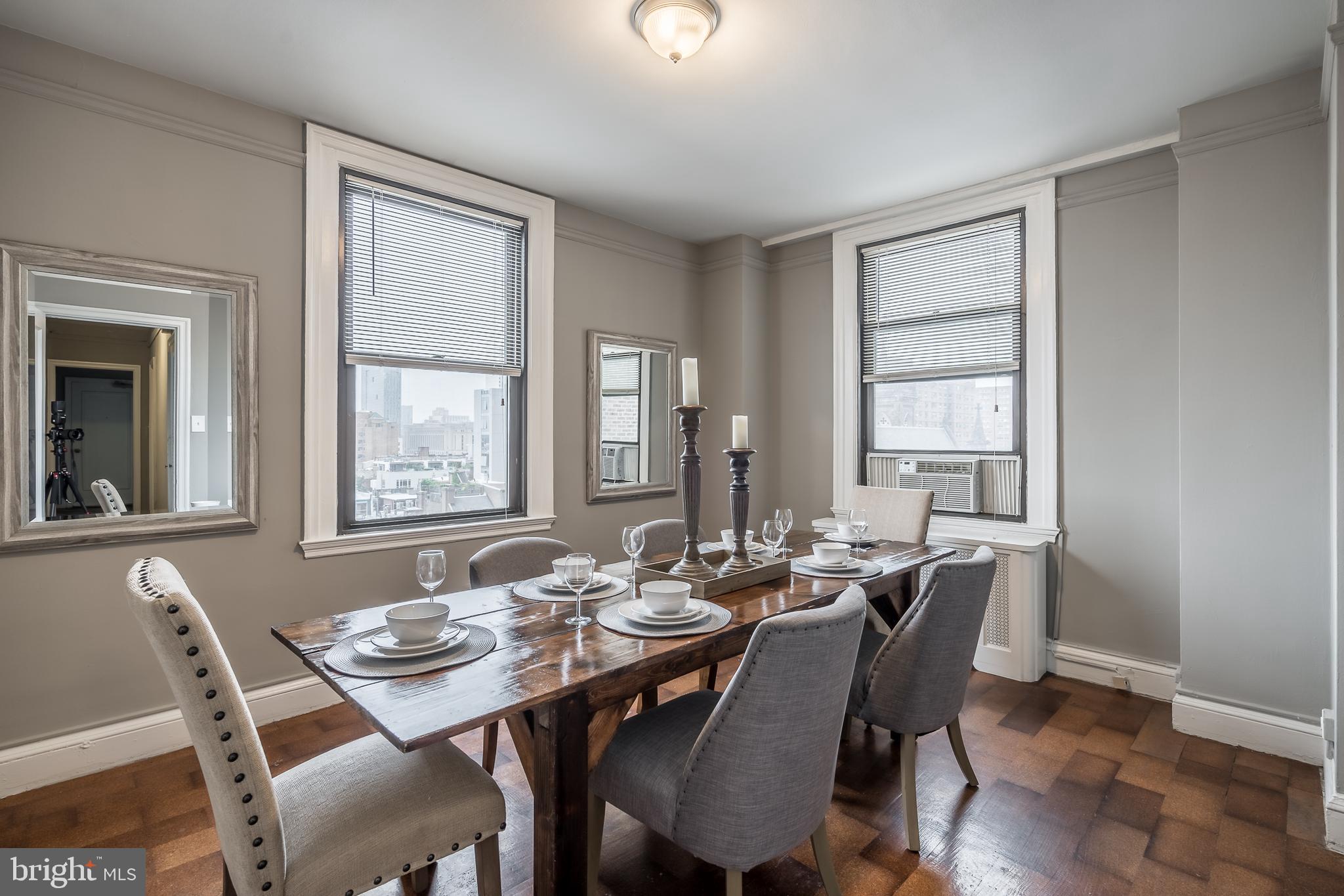 2031 Locust Street, Unit 602 Philadelphia, PA 19103 - Photo 3 of 24 a view of a dining room with furniture and window