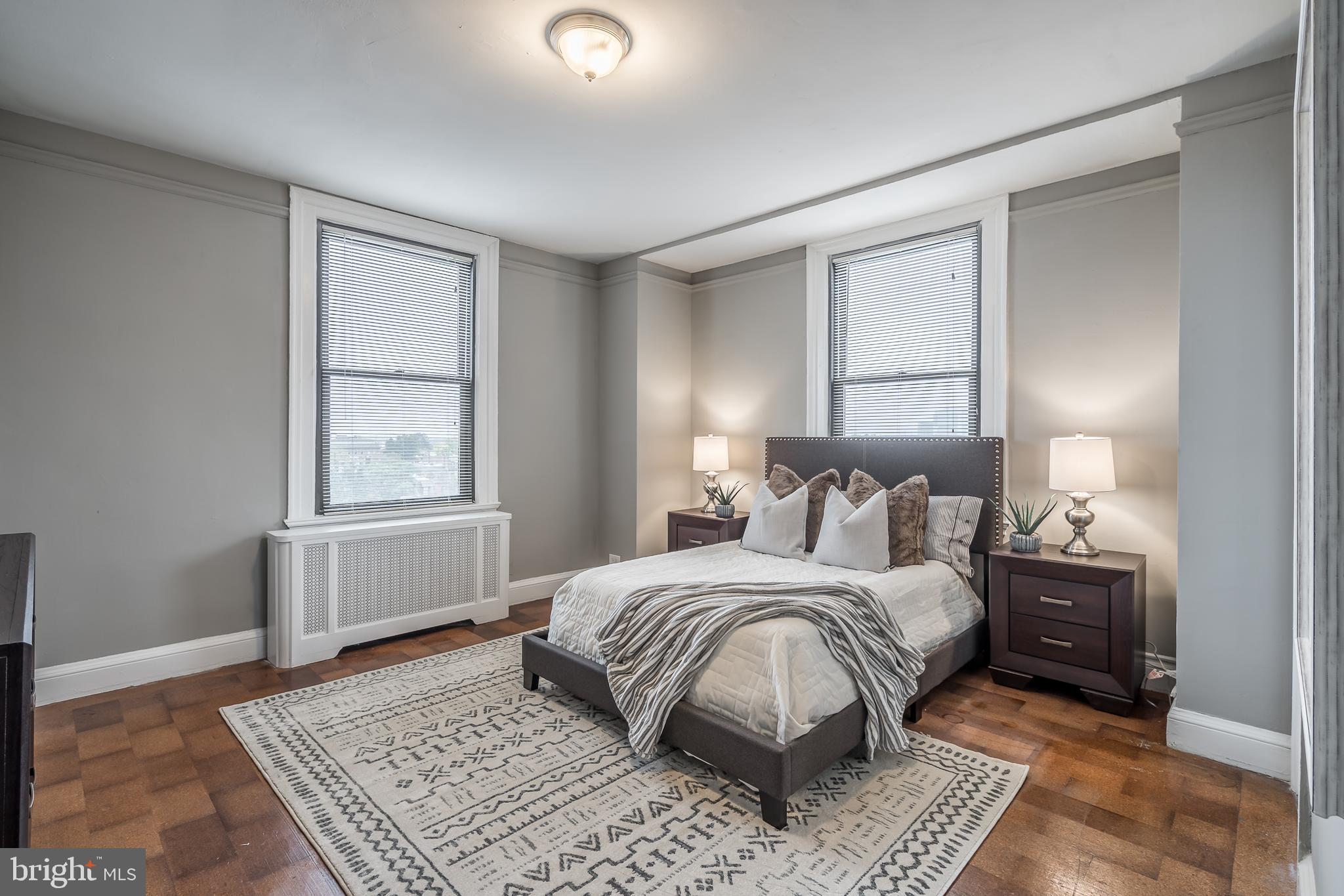 2031 Locust Street, Unit 602 Philadelphia, PA 19103 - Photo 8 of 24 a bedroom with a large bed and a window