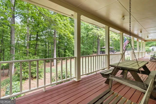 a view of a balcony with wooden floor