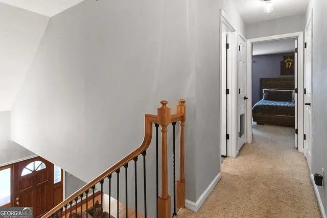 a spacious bedroom with a bed couch and window