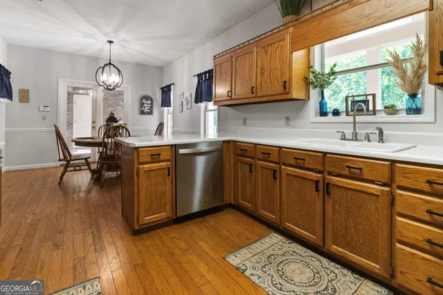 a living room with furniture window and a flat screen tv