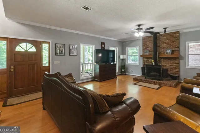 a bathroom with a double vanity sink a mirror and a bathtub