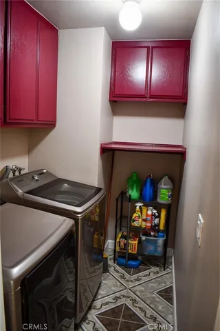 a kitchen with stainless steel appliances a stove and a microwave