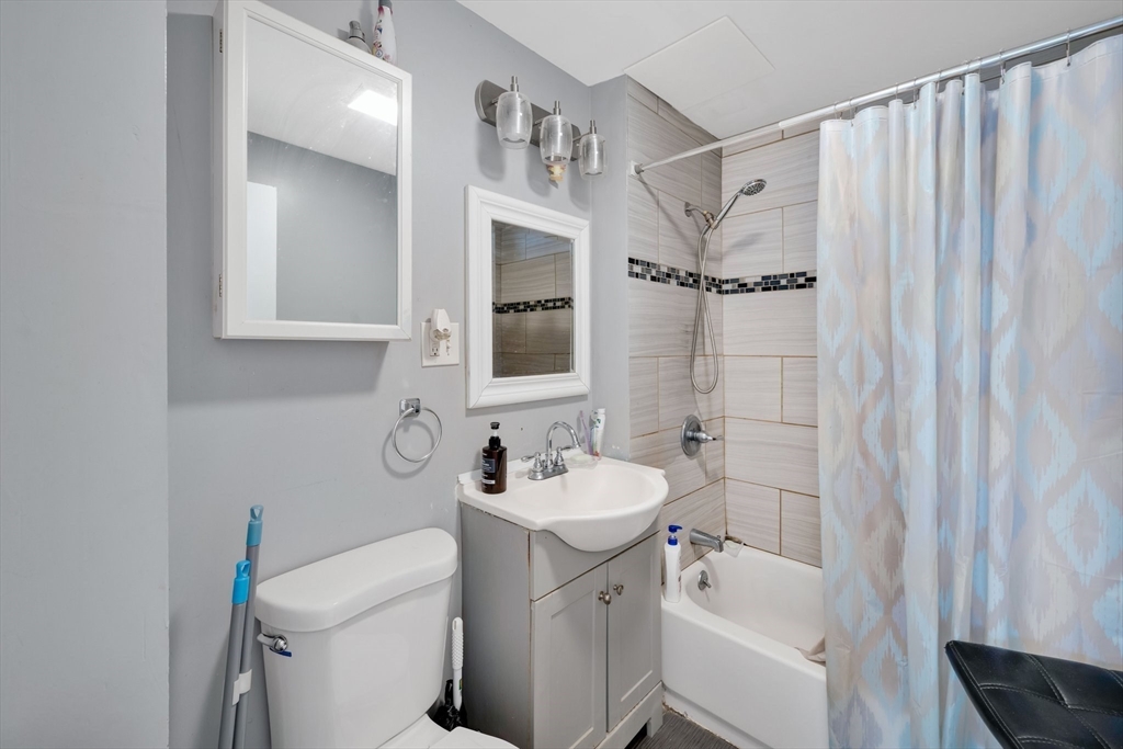 100-102 Wait Street Springfield, MA 01104 - Photo 12 of 35 a bathroom with a sink toilet and shower