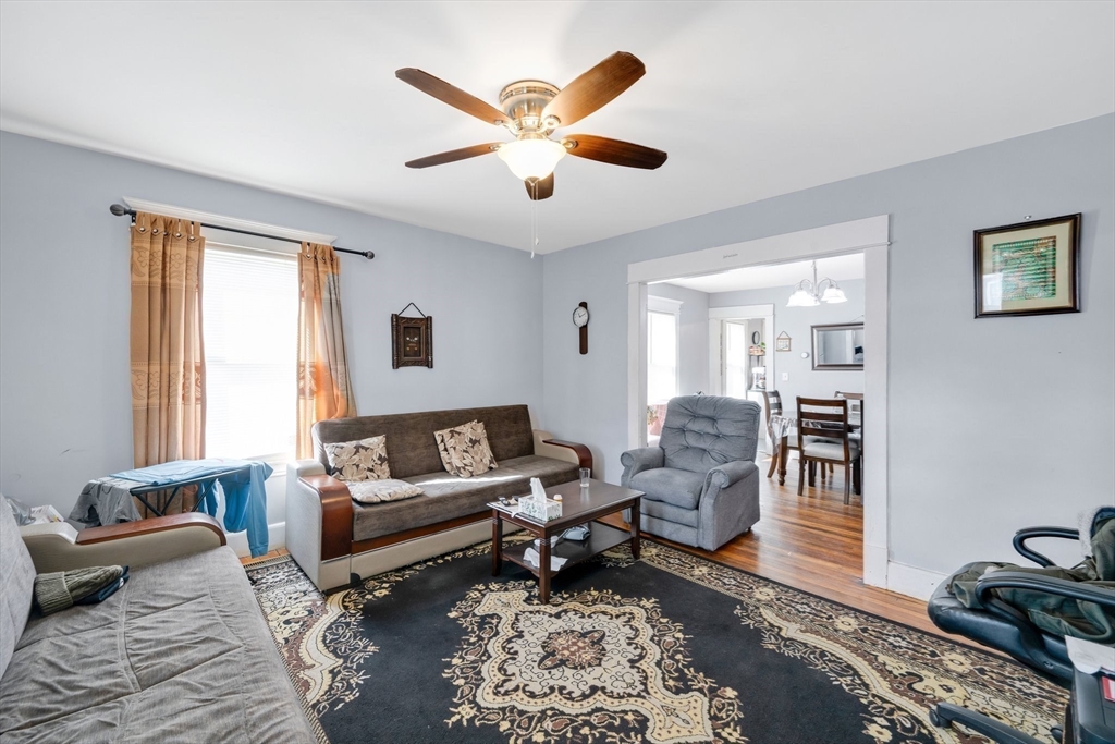 100-102 Wait Street Springfield, MA 01104 - Photo 3 of 35 a living room with furniture and a rug