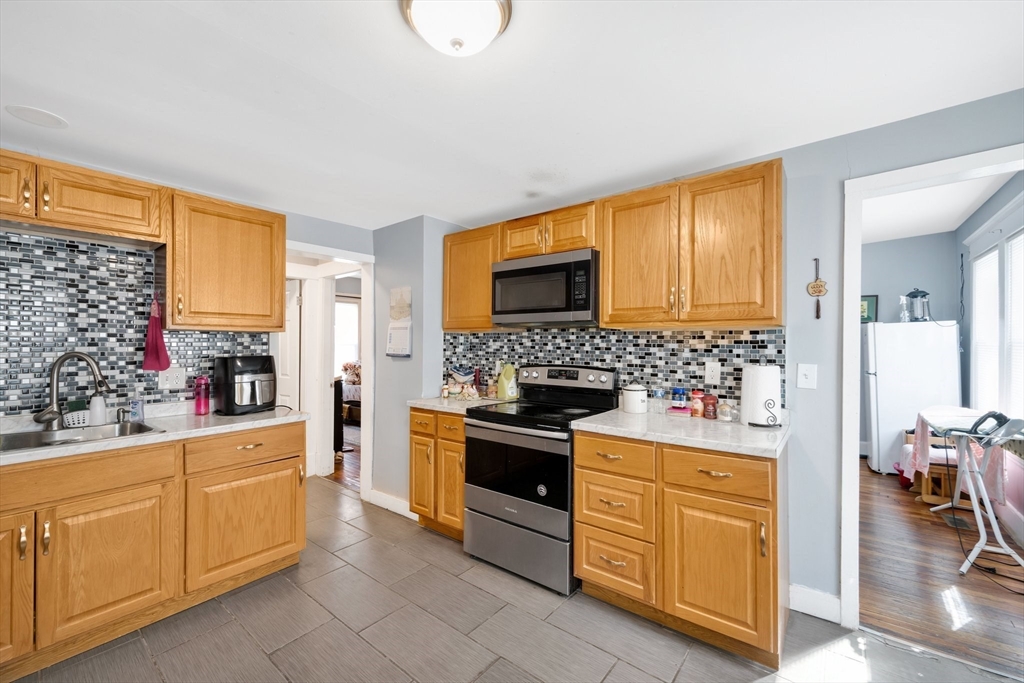 100-102 Wait Street Springfield, MA 01104 - Photo 6 of 35 a kitchen with a stove oven and sink