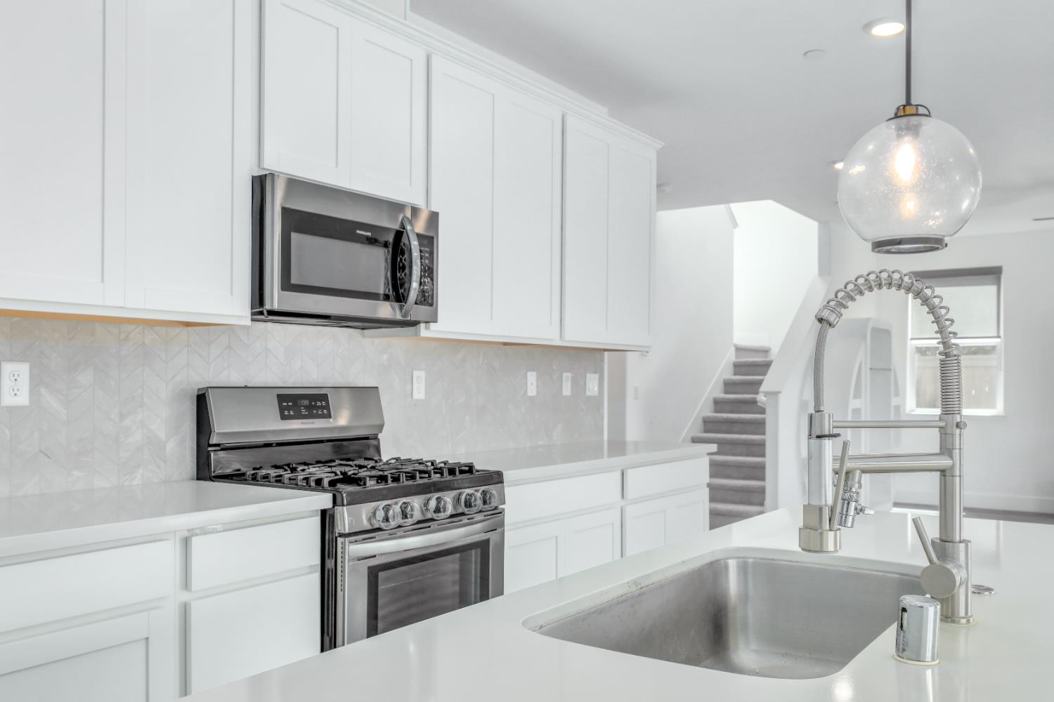 650 Nathaniel Avenue Galt, CA 95632 - Photo 16 of 46 a kitchen with appliances a sink and cabinets