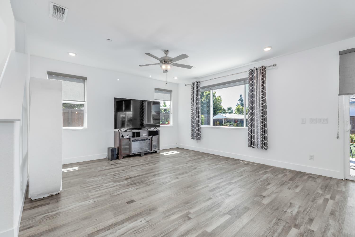 650 Nathaniel Avenue Galt, CA 95632 - Photo 17 of 46 a view of an empty room with a window and wooden floor
