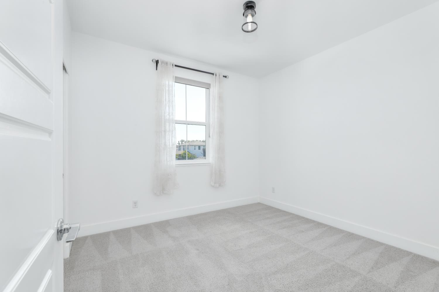 650 Nathaniel Avenue Galt, CA 95632 - Photo 26 of 46 an empty room with a window