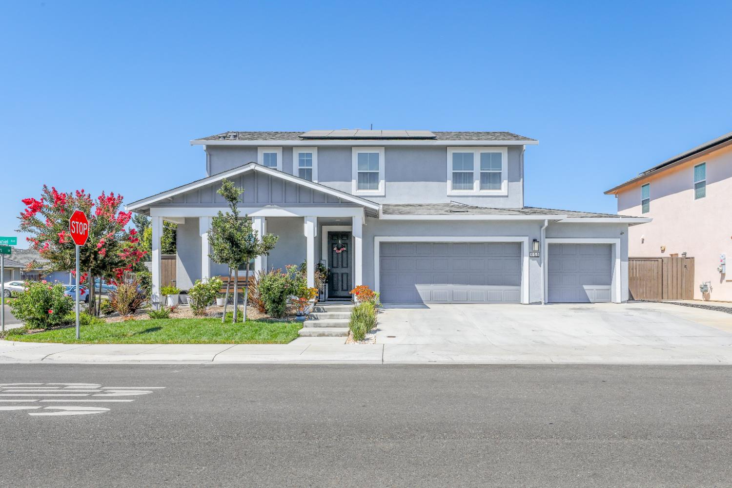 650 Nathaniel Avenue Galt, CA 95632 - Photo 3 of 46 a front view of a house with a yard and a garage