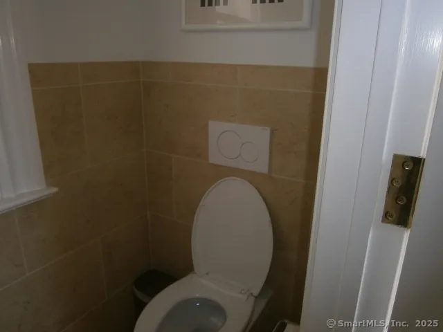 a close view of a toilet in bathroom
