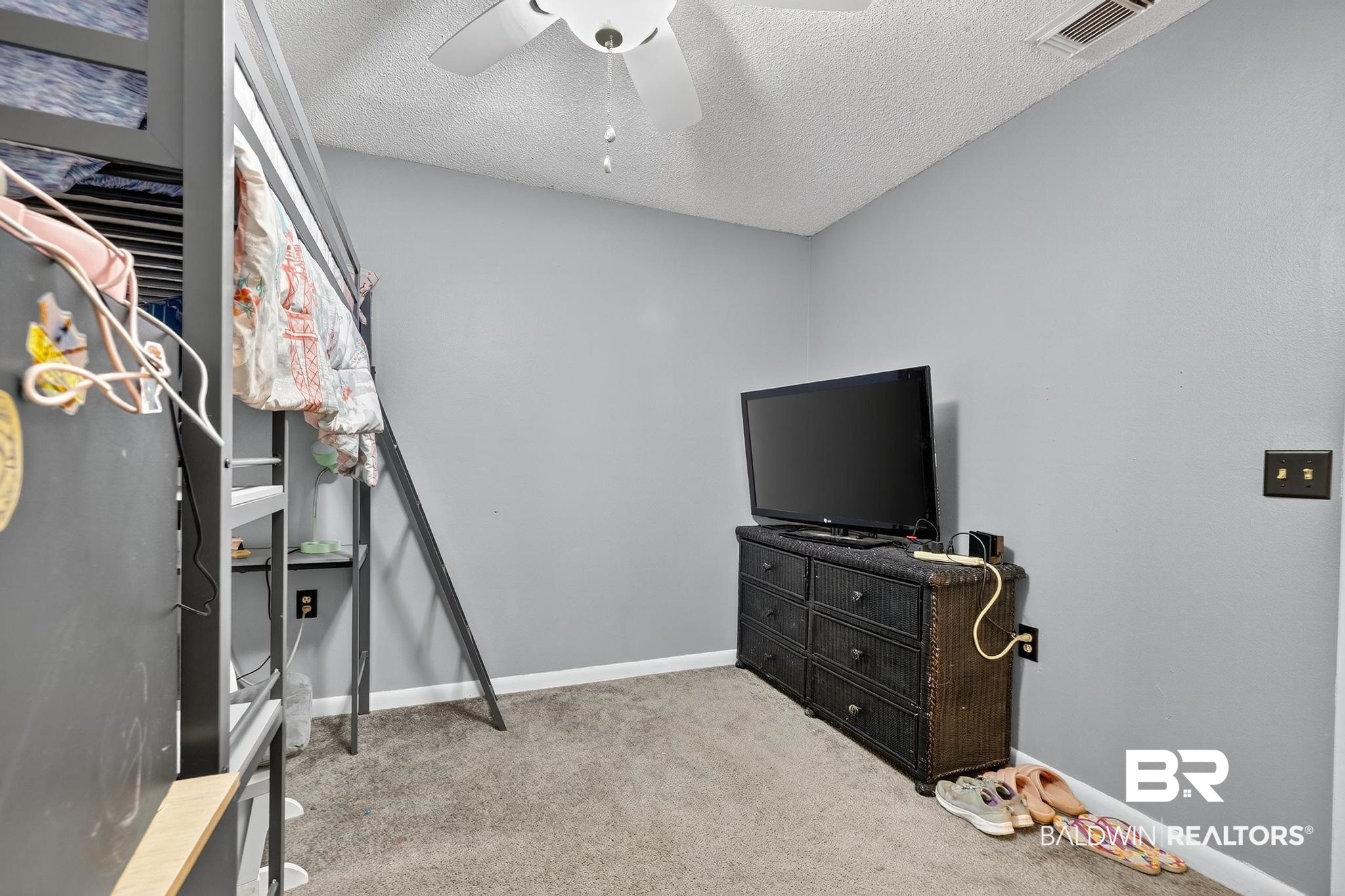 21895 2nd Street Silverhill, AL 36576 - Photo 36 of 43 Bedroom with light carpet and a ceiling fan