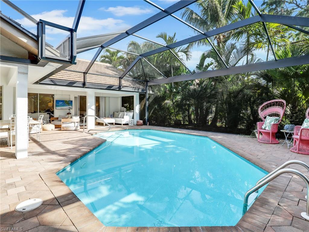 471 Ibis Way Naples, FL 34110 - Photo 24 of 40 a view of a patio with a table and chairs