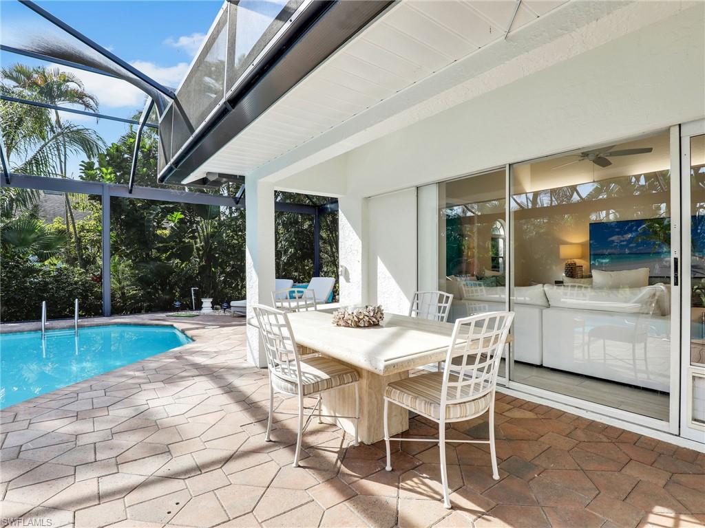 471 Ibis Way Naples, FL 34110 - Photo 26 of 40 a view of a patio with a backyard