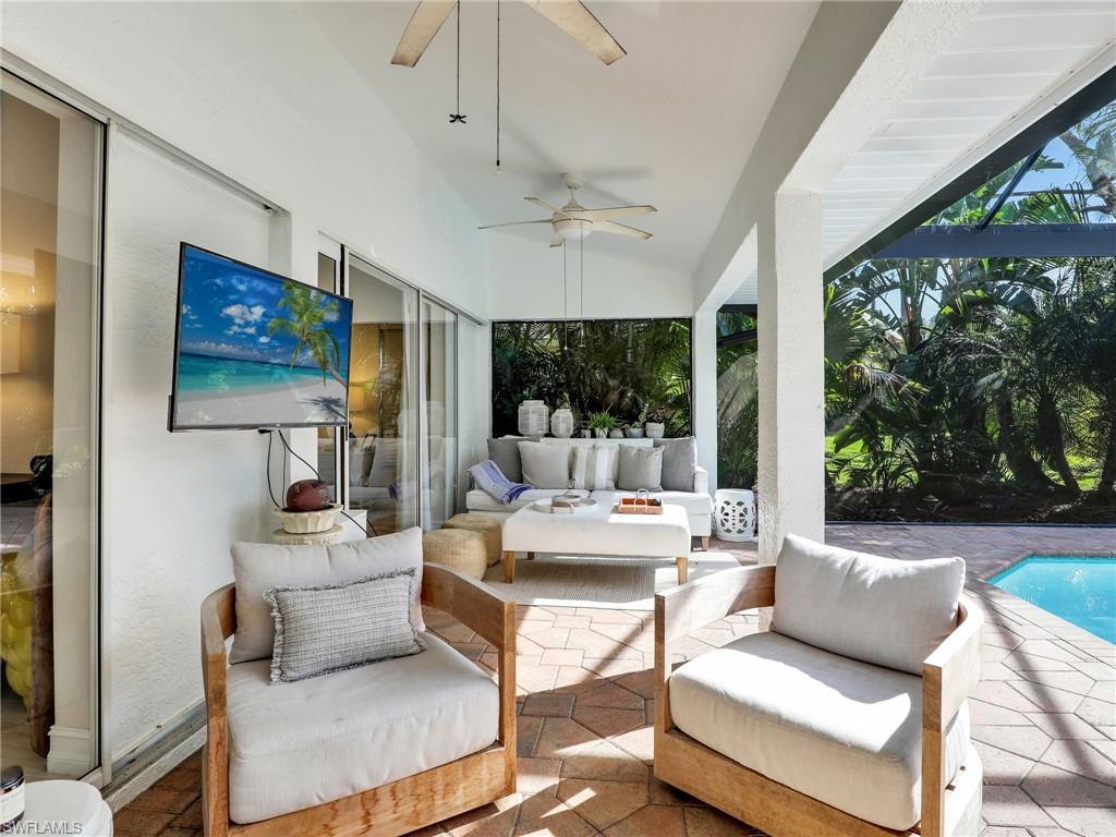 471 Ibis Way Naples, FL 34110 - Photo 27 of 40 a living room with furniture and a large window
