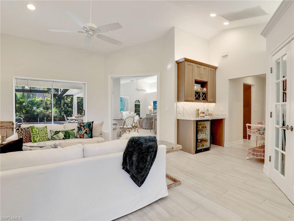 471 Ibis Way Naples, FL 34110 - Photo 5 of 40 a living room with furniture and a large window