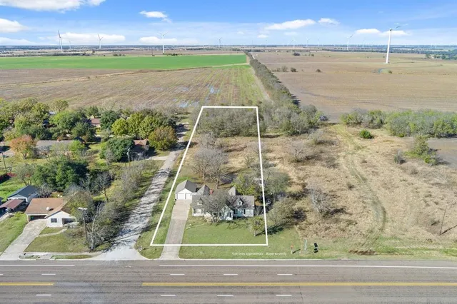 a kitchen with stainless steel appliances granite countertop a red stove top oven a sink and dishwasher