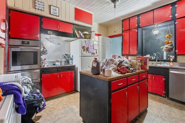 a living room with a sink and a mirror