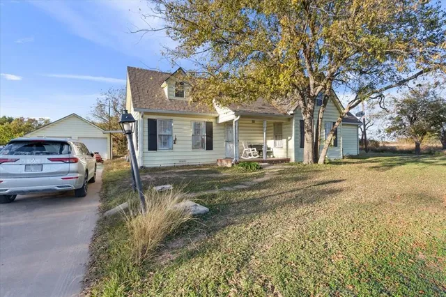 a view of a house with outdoor space and porch