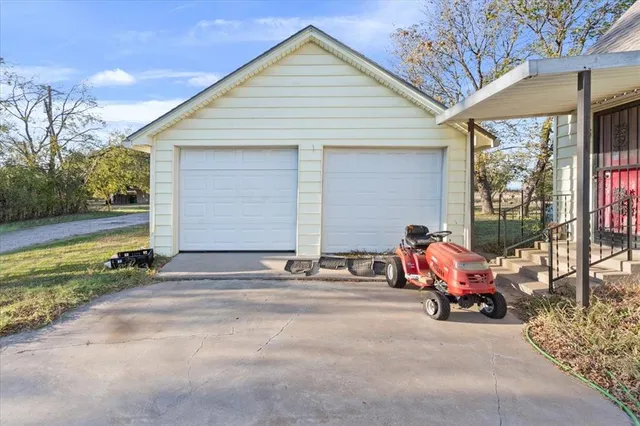 a front view of a house with outdoor seating