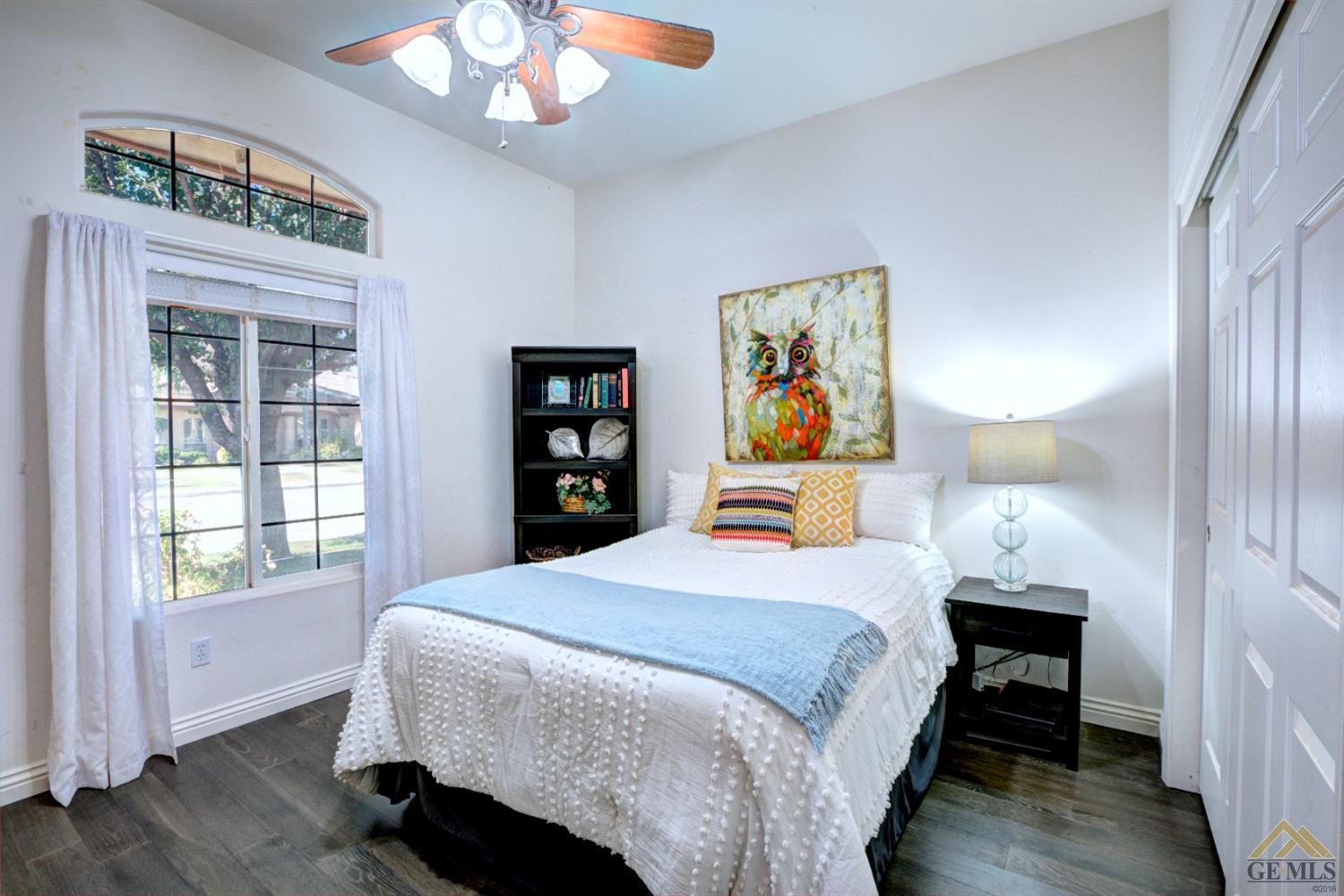 Undisclosed Address Shafter, CA 93263 - Photo 13 of 21 a bedroom with a bed and a window