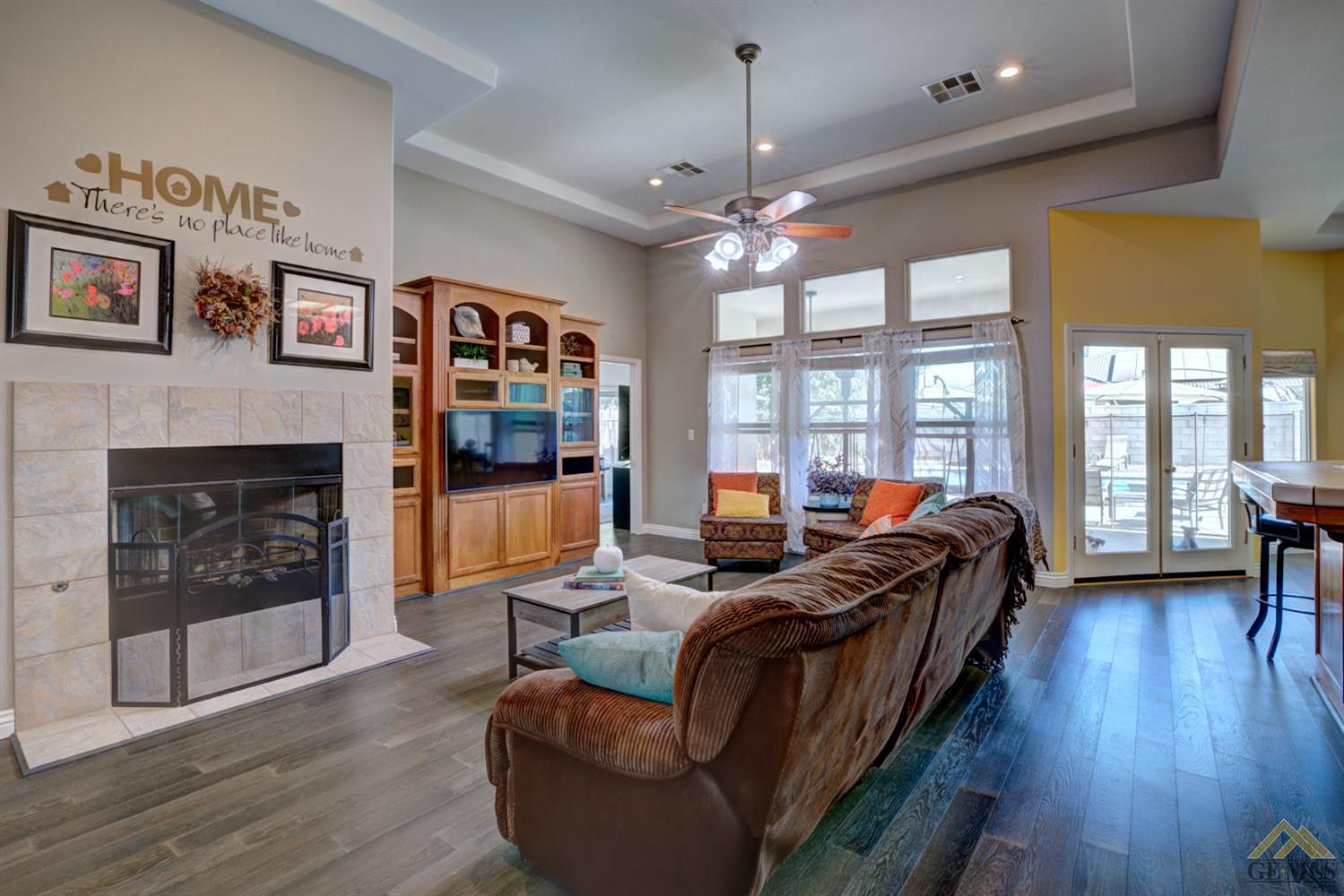 Undisclosed Address Shafter, CA 93263 - Photo 6 of 21 a living room with furniture fireplace and flat screen tv