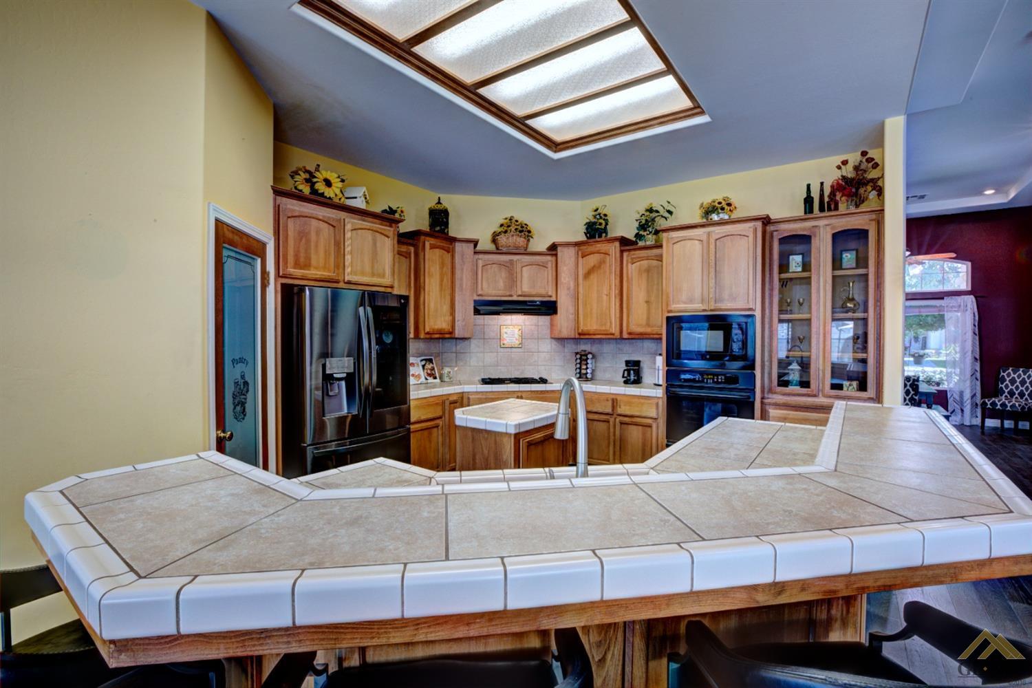 Undisclosed Address Shafter, CA 93263 - Photo 8 of 21 a living room with stainless steel appliances kitchen island granite countertop furniture and a kitchen view