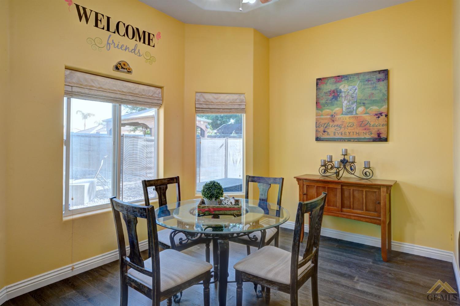Undisclosed Address Shafter, CA 93263 - Photo 9 of 21 a view of a dining room with furniture and wooden floor