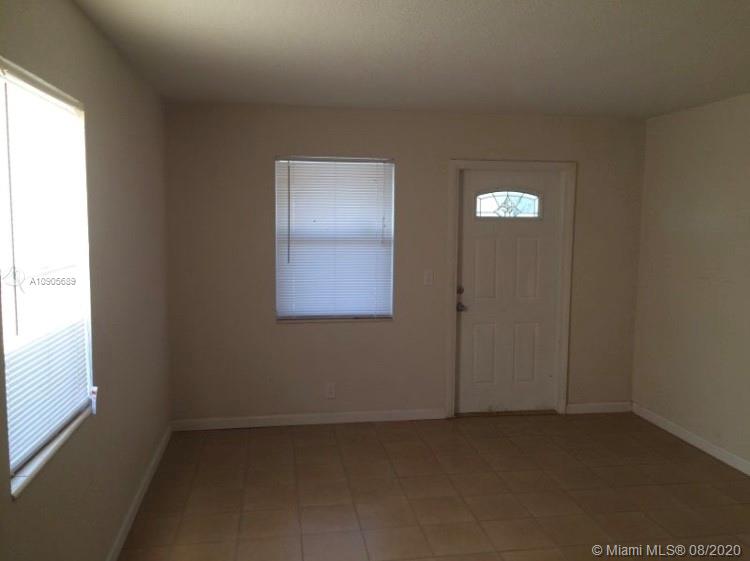 1131 West 4th Street Riviera Beach, FL 33404 - Photo 2 of 7 an empty room with windows