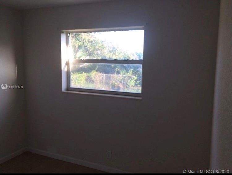 1131 West 4th Street Riviera Beach, FL 33404 - Photo 5 of 7 a small space with a window
