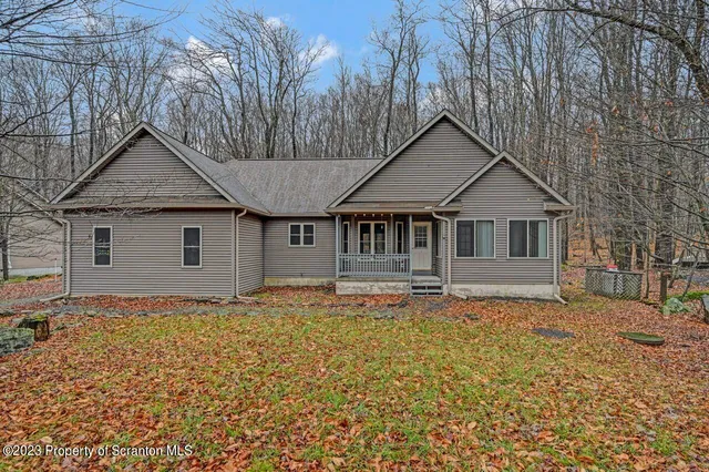 a house with trees in the background