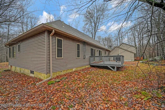 a backyard of house with wooden fence
