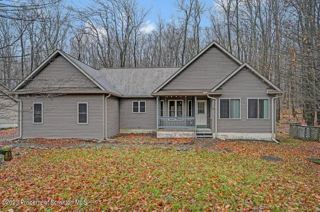 a house that has tree in front of it