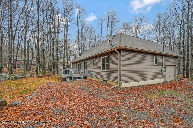 a backyard of house with large trees