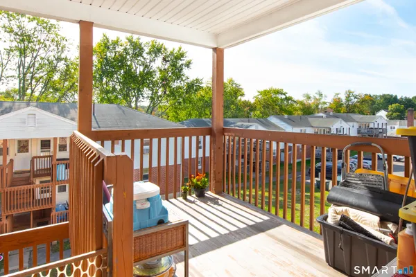 a view of a balcony with wooden floor