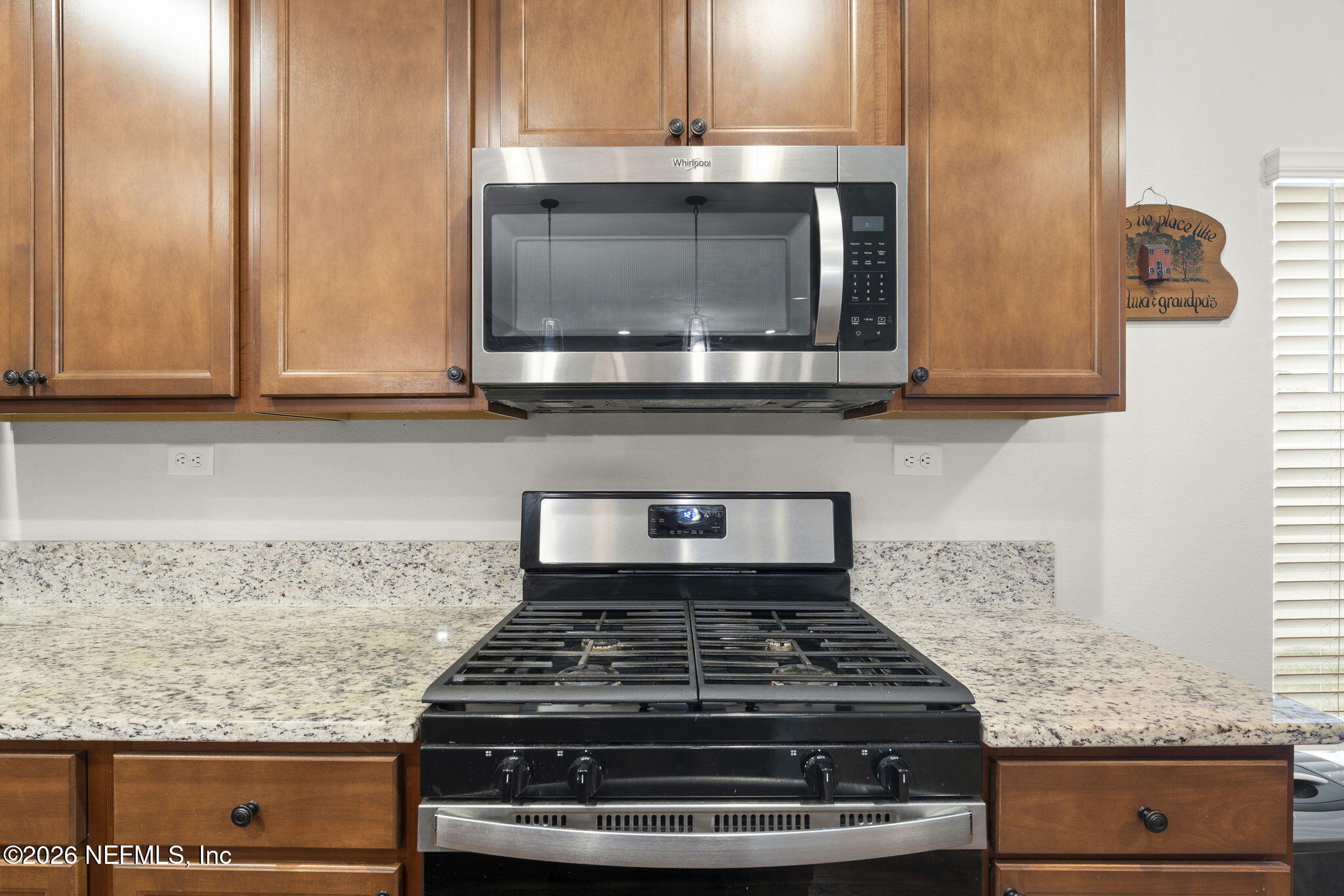 620 Ivory Palm Road Orange Park, FL 32073 - Photo 13 of 53 a kitchen with granite countertop a stove and a microwave