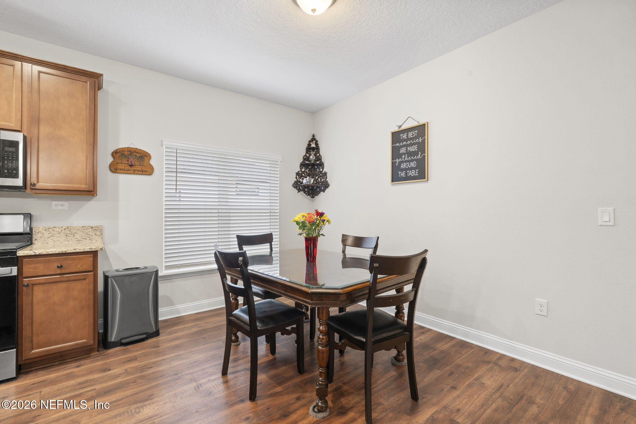 620 Ivory Palm Road Orange Park, FL 32073 - Photo 15 of 53 a view of a dining room with furniture and wooden floor