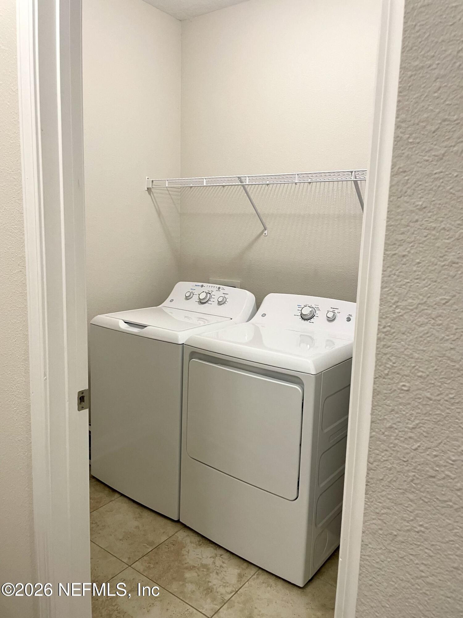 620 Ivory Palm Road Orange Park, FL 32073 - Photo 18 of 53 a utility room with dryer and washer