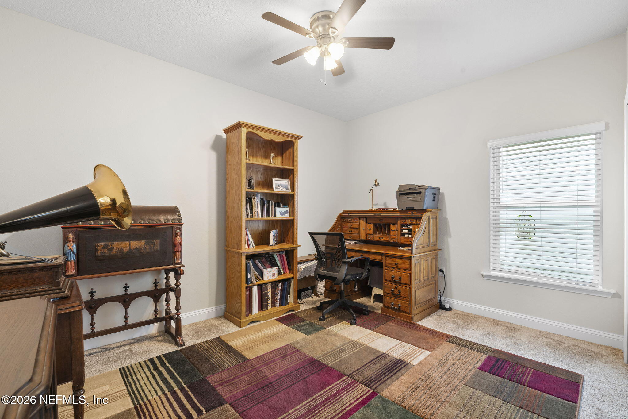 620 Ivory Palm Road Orange Park, FL 32073 - Photo 21 of 53 a view of a workspace with furniture and a window