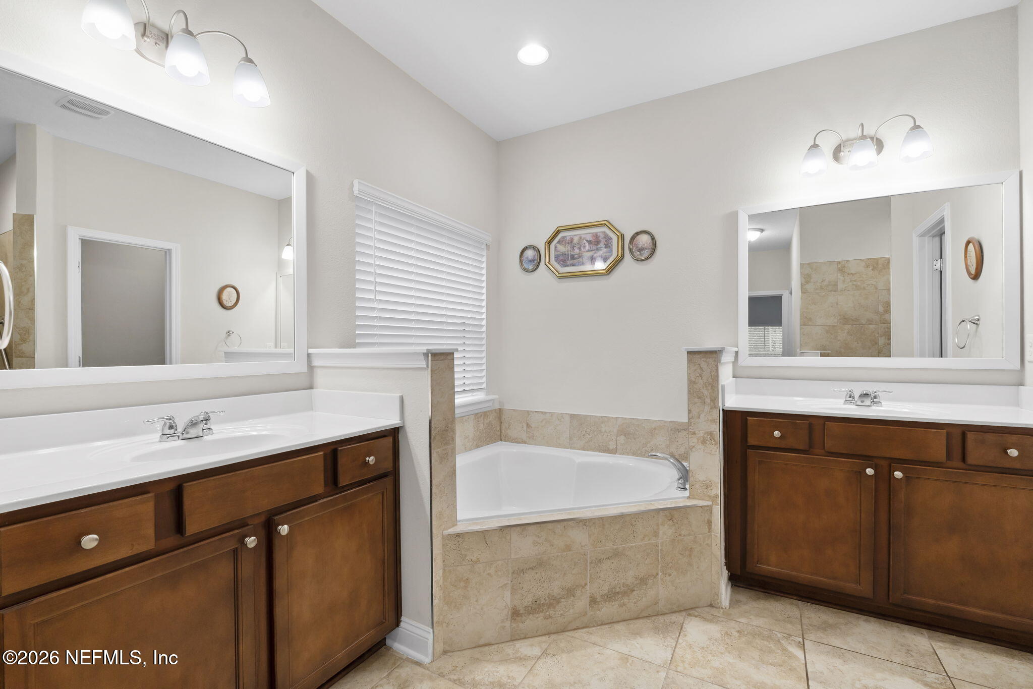 620 Ivory Palm Road Orange Park, FL 32073 - Photo 26 of 53 a spacious bathroom with a tub sink and mirror