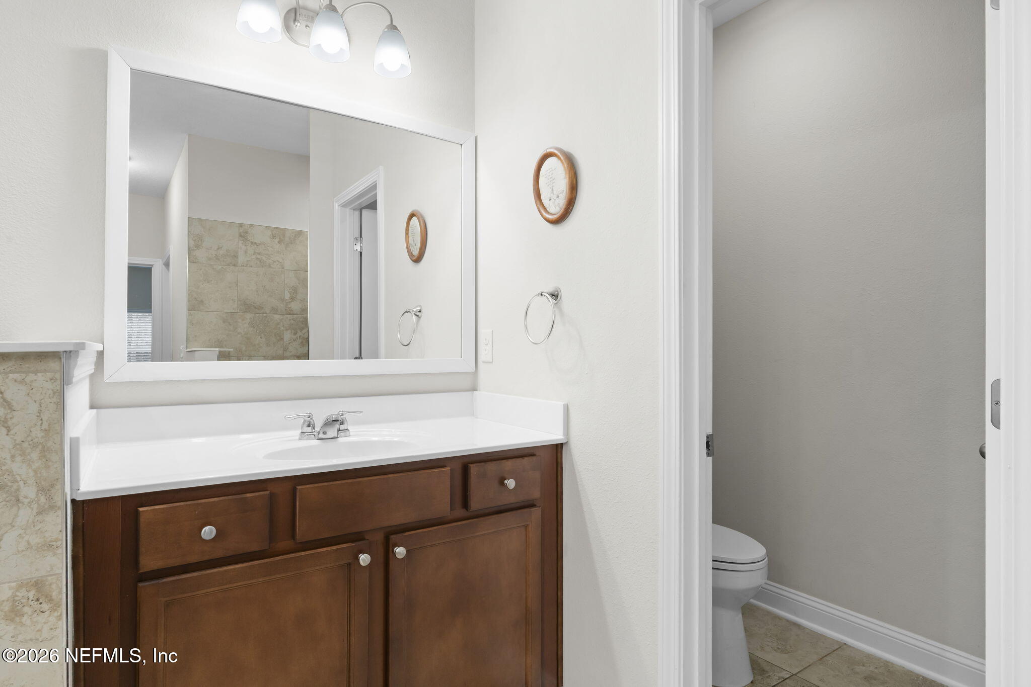 620 Ivory Palm Road Orange Park, FL 32073 - Photo 28 of 53 a bathroom with a sink and a mirror